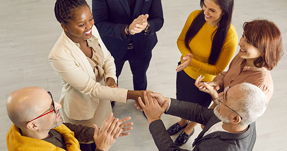 happy employees shaking hands