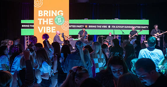 live band and event attendees dancing at corporate event party