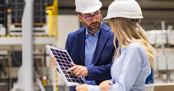 solar panel sales representative and channel partner discussing installation