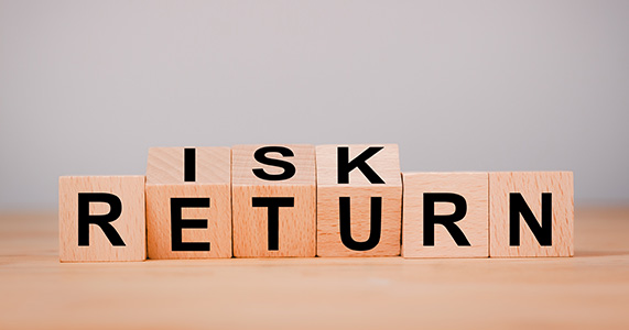 blocks with letters spelling risk and return