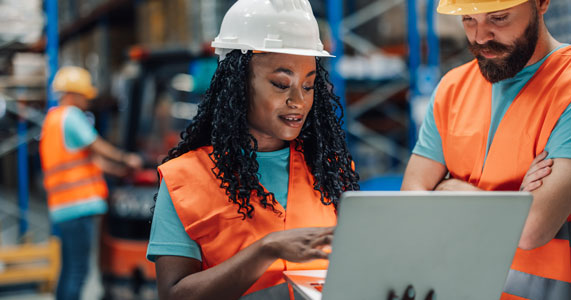 warehouse employees participating in workplace safety activity